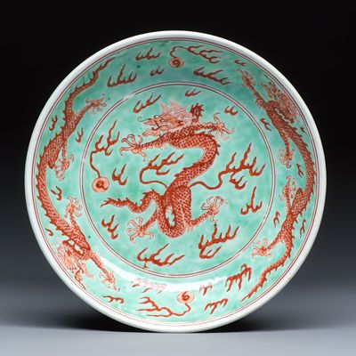 A Chinese iron-red-decorated and green-enamelled 'Dragon' plate, Kangxi mark and of the period