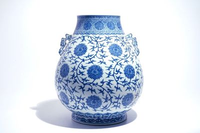 A Chinese blue and white lotus scroll hu vase, Qianlong mark, 20th C.
