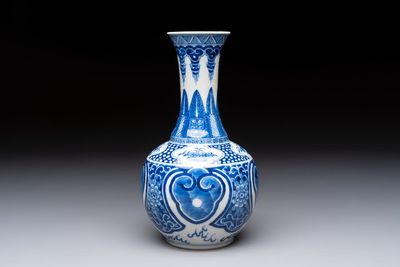 A Chinese blue and white vase with floral design, 19th C.
