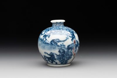 A Chinese blue, white and copper-red 'monkeys' snuff bottle, Yongzheng mark, 19th C.