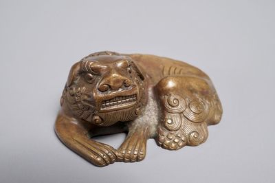 A Chinese bronze scroll or paper weight shaped as a Buddhist lion or Shishi, 17/18th C.