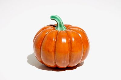 A Chinese coral-glazed model of a pumpkin, 19/20th C.