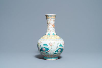 A Chinese famille rose bottle vase with mandarin ducks in a lotus pond, 19th C.