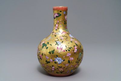 A Chinese famille rose gilt-ground bottle vase with floral design, Qianlong mark, 19/20th C.