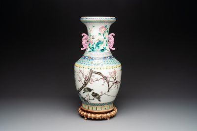A Chinese famille rose 'magpies and plum blossoms' vase on wooden stand, 19th C.