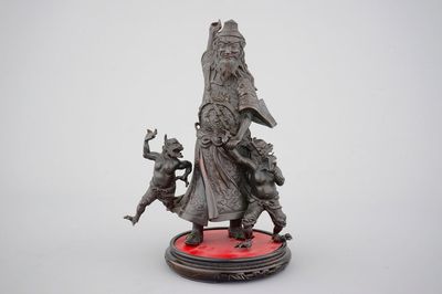 A Chinese mythological bronze group, 19/20th C.