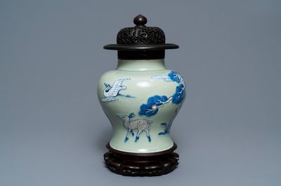 A Chinese underglaze red, blue and white celadon-ground vase, Kangxi
