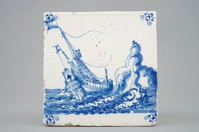 A Dutch Delft tile with a ship near rocks, late 17th C.