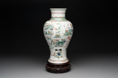 A fine Chinese famille verte 'mythical creatures' vase on a reticulated wooden stand, Kangxi