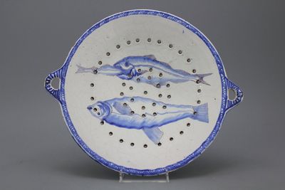 A Frisian Delft Makkum tripod fish strainer ca. 1800
