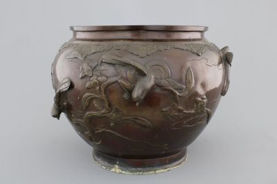 A Japanese bronze relief-decorated jardiniere, 19th C.