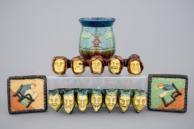 A lot of Flemish folk art pottery: 2 pipe racks, 2 tiles and a vase, early 20th C.