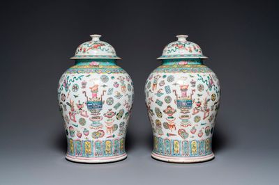 A pair of Chinese famille rose 'antiquities' vases and covers, 19th C.