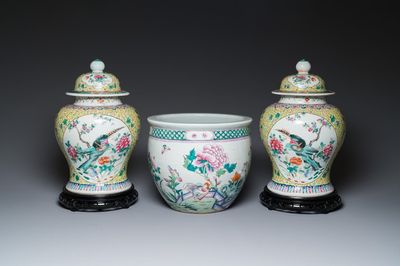 A pair of Chinese famille rose covered vases and a jardinière, 19/20th C.