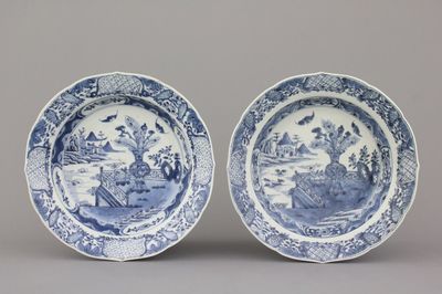 A pair of Chinese porcelain blue and white plates with landscape decoration, 18th C.
