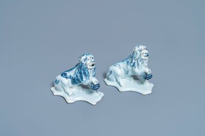 A pair of Dutch Delft blue and white models of lions, 18th C.