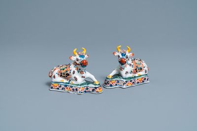 A pair of polychrome Dutch Delft models of cows, 18th C.