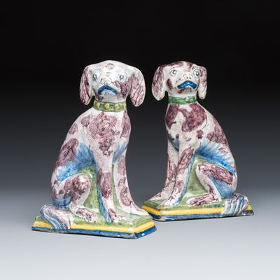 A pair of polychrome Dutch Delft money banks modelled as dogs, 18th C.
