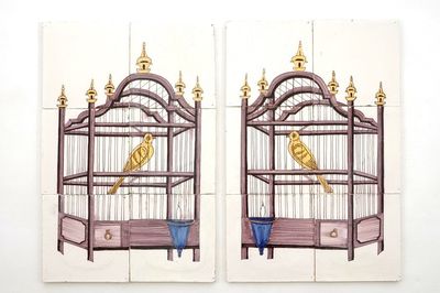 A pair of polychrome Dutch Delft tile panels with canaries in a cage, 18/19th C.