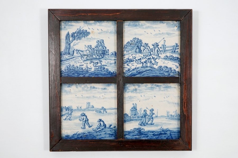 A set of four Dutch Delft blue and white "Open landscape" tiles, 18th C.