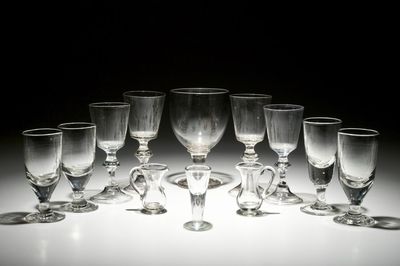 Ten stemmed glasses and two small glass jugs, England, 18/19th C.