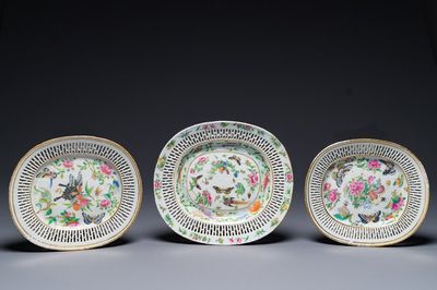 Three Chinese Canton famille rose reticulated oval dishes with flowers, butterflies and marine animals, 19th C.