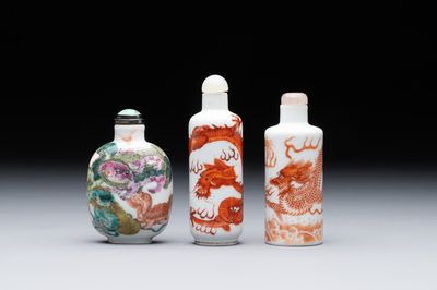 Three Chinese famille rose and iron-red 'Buddhist lion' and 'dragon' snuff bottles, 19th C.