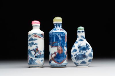 Two Chinese blue, white and copper-red snuff bottles and a blue and white 'crab' snuff bottle, Chenghua and Qianlong mark, 19th C.