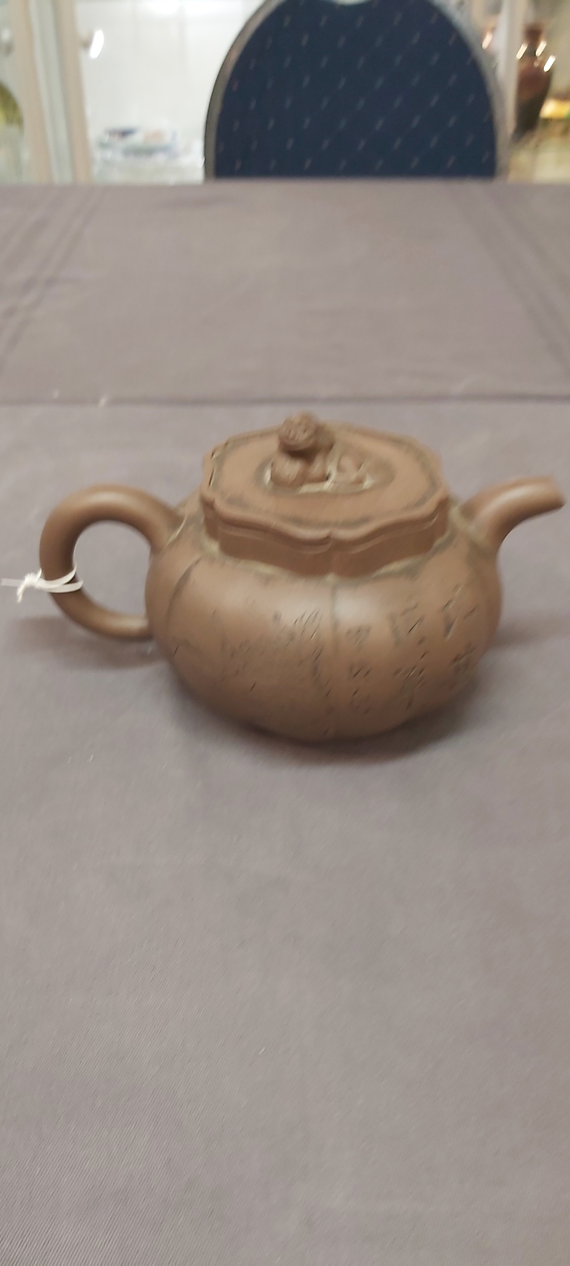 A Chinese Yixing stoneware teapot and cover, signed Li Yong 利永, Yixing