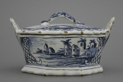 A fine Dutch Delft blue and white butter tub with landscape painting, 18th C.