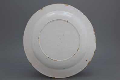 A monochrome white Dutch Delft dish of circular form, late 17th C.