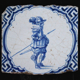 A set of 15 Dutch Delft blue and white tiles with various scenes of people, Wan-Li corners, 17th C.