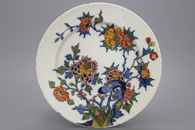 A Dutch Delft polychrome plate with a floral design, late 17th C.