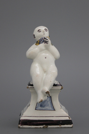 A French ceramic figure of a boy on a base, 18th C.