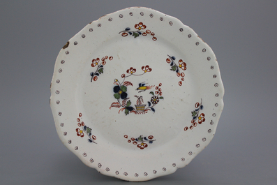 A Brussels faience lobed &quot;floral hedge&quot; plate, 18th C.