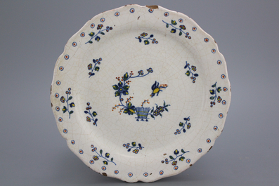 A Brussels faience lobed &quot;floral hedge&quot; plate, 18th C.