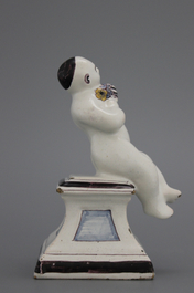 A French ceramic figure of a boy on a base, 18th C.