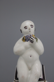 A French ceramic figure of a boy on a base, 18th C.