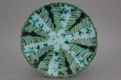 A lobed Brussels faience dish with leaf patterns, 18th C