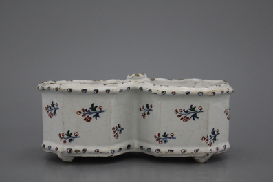 A Brussels faience &quot;floral hedge&quot; cruet stand, 18th C.