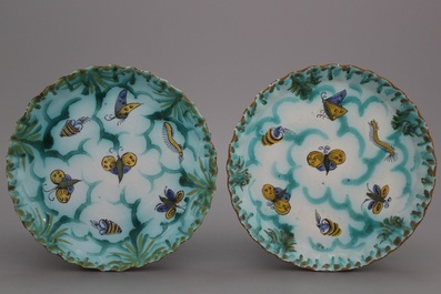 A pair of notched Brussels faience butterfly plates, 18th C.