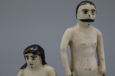 A Qadjar figural group with a nude man and woman with a dog, 19th C.