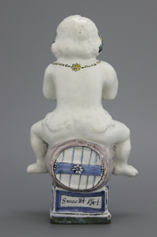 A Brussels faience table fountain, modelled as Bacchus seated on a barrel, 18th C.