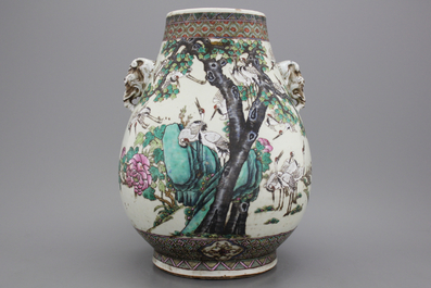 A wonderful Chinese porcelain famille rose hu vase with elephant handles, 19th C.