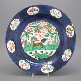 A large powder blue ground famille verte dish, Kangxi, ca. 1690