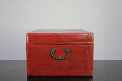 A Chinese red leather trunk, early 20th C.