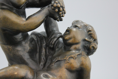 A bronze group depicting the young Bacchus , signed Clodion, 19th C.