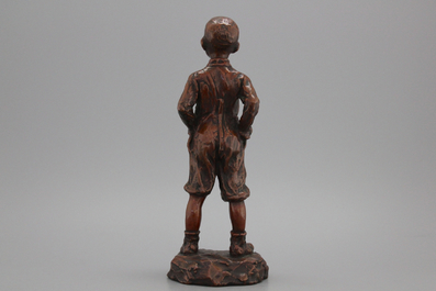 A brass figure of a boy, early 20th C.