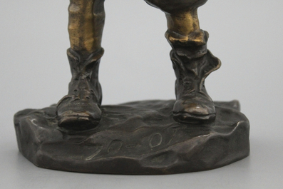 A bronze figure of a young boy, signed Louis Oury