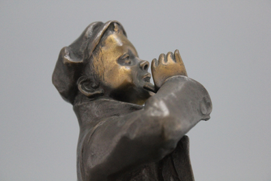 A bronze figure of a young boy, signed Louis Oury